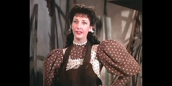 Virginia O'Brien as Alma, proving she can shoe a horse in The Harvey Girls (1946)