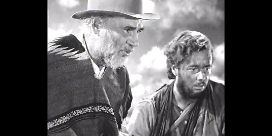 Walter Huston as Howard and Tim Holt as Curtin come across an unfortunate discovery in The Treasure of the Sierra Madre (1948)