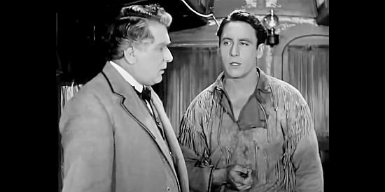 Will Walling as Thomas Marsh and George O'Rien as Dave Brandon discuss a pass his father found years earlier in The Iron Horse (1924)