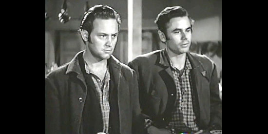 William Holden as Dan Thomas and Glenn Ford as Tod Ramsey, two young troublemakers facing a judge in Texas (1941)
