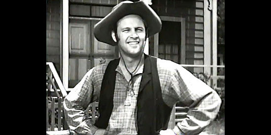 William Holden as Dan Thomas, arriving in Abilene and looking for a meal in Texas (1941)