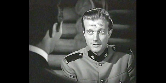 William Lundigan as Jim Gardiner, the duty-bound Mountie all grown up in Northwest Rangers (1942)