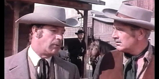 Conrado San Martin as Ted Shore and Luis Induni as the sheriff talk discuss the best way to do away with a problem in Winchester Bill (1967)