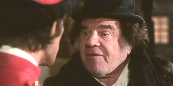 Lionel Stander as Doctor Higgins, informing Cormack of his son's condition in Cormack of the Mounties (1975)