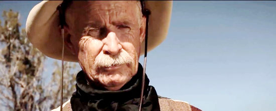 Mark Baugher as Dockie Barnett, who rides off with his children in search of killers in C-Bar (2015)