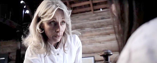 Sande Comenzind as Marsha Jean Barnett, taking care of one of Buck Montgomery's victims in C-Bar (2015)