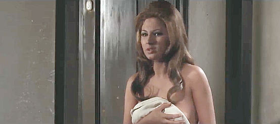 Monica Pardo as the saloon girl Glenn accidentally winds up in bed with in Dead for a Dollar (1968)