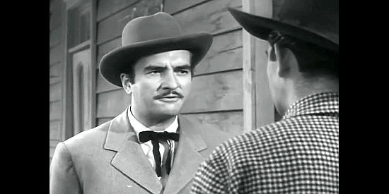 Donald Curtis as Stanton, a land speculator at odds with cattleman Mike McCall in Stampede (1949)