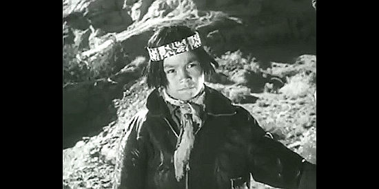 Francis Kee Teller as Son of the Hunter, listening to one of his grandfather's stories in Navajo (1952)