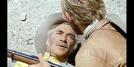 Guillermo Mendez as the major, sharing the secret of the coins with Alan Burton just before dying in Three Silver Dollars (1968)