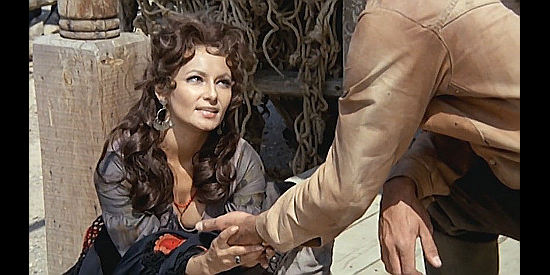 Maria Mizer as a fortune teller who takes an interest in Alan Burton in Three Silver Dollars (1968)