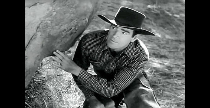 Rod Cameron as Mike McCall, trying to avoid being ambushed in Stampede (1949)