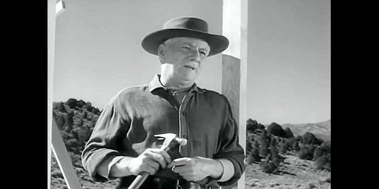 Steve Clark as John Dawson, building on his new land in spite of the cattleman's warning in Stampede (1949)