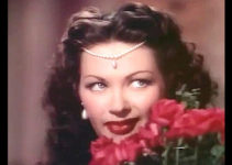 Yvonne De Carlo as Salome turns on the charm to charm secrets out of a court in Salome Where She Danced (1945)