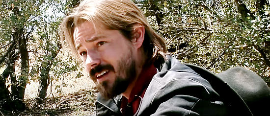 Adam Newberry as Billy Caulder, a young gun eager to try his skill against Bannock in Bannock (2014)