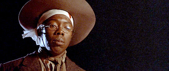 Charles Lane as Weezie, the posse member who helps smuggle the gang out of Cuba in Posse (1993)
