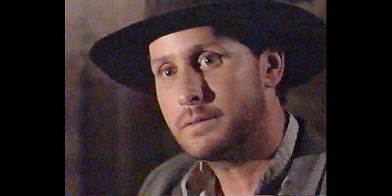 Emilio Estevez as the cowboy with no name in Dollar for the Dead (1999)
