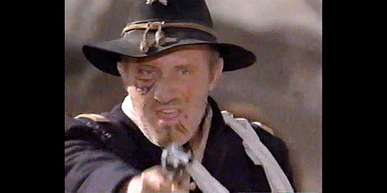 Jonathan Banks as Col. Skinner, commander of the Redlegs in pursuit of the gold in Dollar for the Dead (1999)