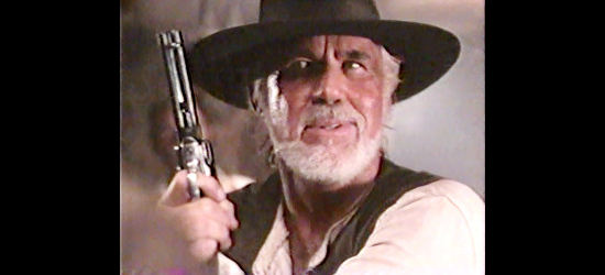 Kenny Rogers as Quentin Leech, trying to learn the outlaws whereabouts in Rio Diablo (1993)