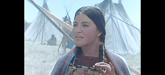 Kimberly Guerrero as Kate Bighead, watching Cheyenne braves prepare for battle in Son of the Morning Star (1991)
