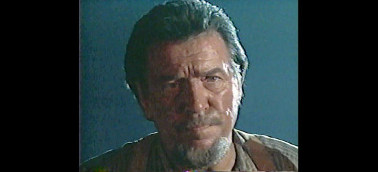 Waylon Jennings as Tobey, facing the vengeance of Holden in Outlaw Justice (1999)