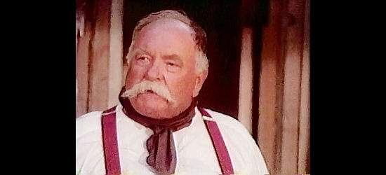 Wilford Brimley as C.C. Tarpley, the neighboring rancher who holds a mortgage on the Calloway land in Good Old Boys (1995)