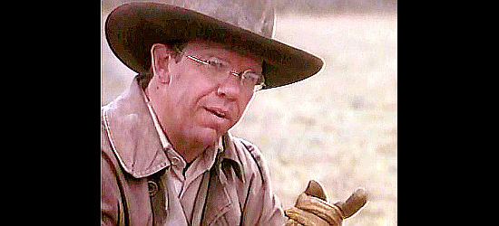 Charles Martin Smith as Ned Brookshire, the eastern railroad man sent to accompany Call in Streets of Laredo (1995)