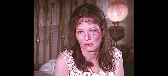 Christine Belford as Eliza, showing the marks of an abusive lover in The Gambler (1980)