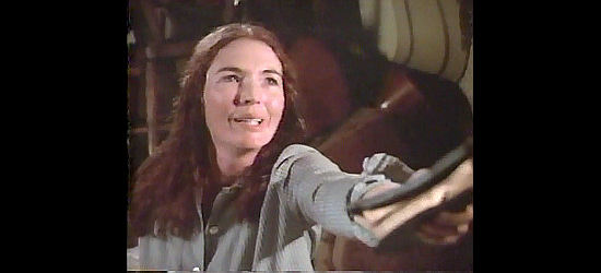 Fionnula Flanagan as Ginny, appoint three strangers as godfathers to her child in The Godchild (1974)