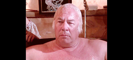 George Kennedy as Gen. Miles, caught in a compromising position by Brady Hawkes in The Gambler -- The Legend Continues (1987)
