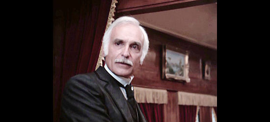 Harold Gould as Arthur Stobridge, the rich railroad owner who has no intention of paying the ransom for Hawkes' son in The Gambler -- The Adventure Continues (1983)