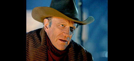 James Arness as Thomas Dunston, determined to recover his herd and settle a score in Red River (1988)