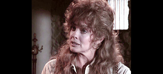Linda Gray as Mary Collins, a school teacher concerned about the plight of the Indians in The Gambler -- The Legend Continues (1987)
