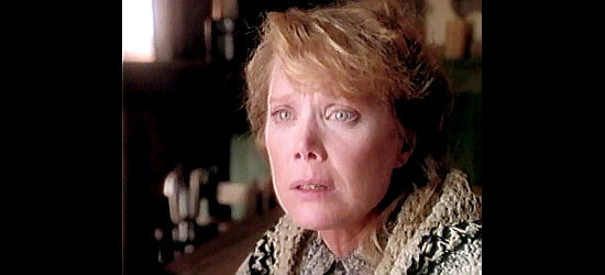 Sissy Spacek as Lorena, getting disturbing news about an old adversary in Streets of Laredo (1995)