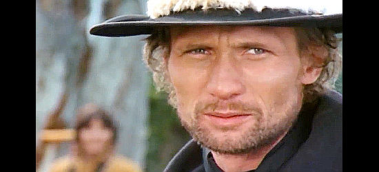 Arthur Brauss as the Tornado Kid, the vicious outlaw who brings trouble to Happy Town in The Cry of the Black Wolves (1972)