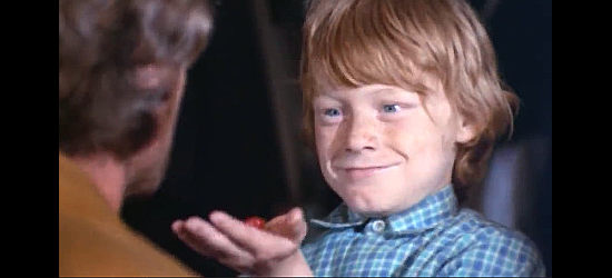 Jean-Claude Hoffman as Jimmy, the young orphan Bill Robbins takes under his wing in The Cry of the Black Wolves (1972)