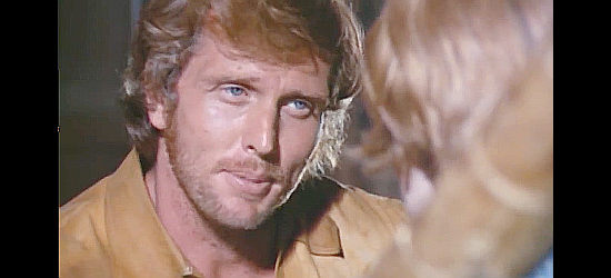 Ron Ely as Bill Robbins, trying to teach young Jimmy a lesson in The Cry of the Black Wolves (1972)