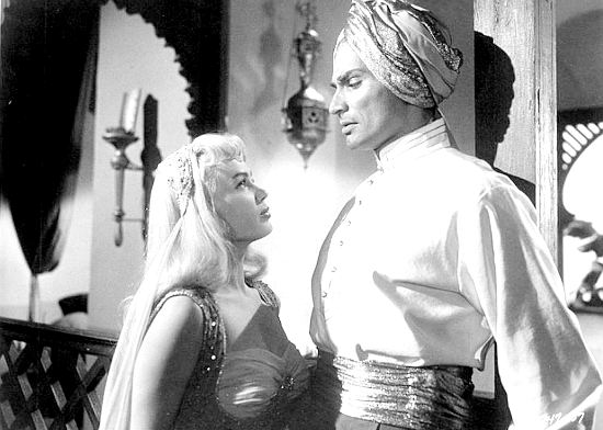 Mamie Van Doren as harem girl Lilith introduces herself to a befuddled Jason Starbuck (Jeff Chandler) in Yankee Pasha (1954)