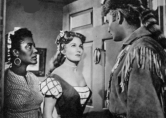Rhonda Fleming as Roxana Reil answers the door to find handsome stranger Jason Starbuck (Jeff Chandler) calling on her in Yankee Pasha (1954)