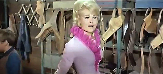 Barbara Bold as Cathy Carmichael greeting Sam Dobie, her new salesman in Who Killed Johnny R? (1966)