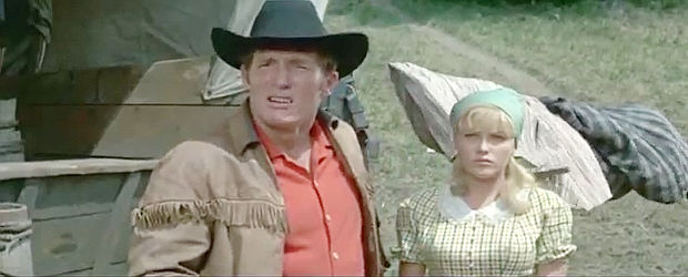 Brad Harris as Phil Stone and Olga Schoverova as Mary Brendel in Massacre at Marble City (1964)