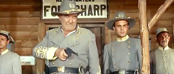 Broderick Crawford as Col. Lennox, ready to shoot his own men to keep them in line in Mutiny at Fort Sharp (1966)