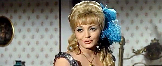 Dada Gallotti as saloon girl Ilona, spilling her inside information on Lost Treasure of the Incas (1964)