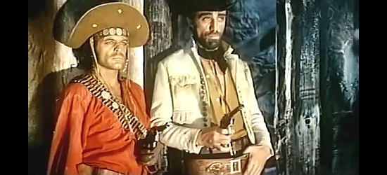 Klaus Kinski as Jose and Sieghardt Rupp as Fernando, members of the Ortiz gang having fun at Woody's expense in Last Ride to Santa Cruz (1964)