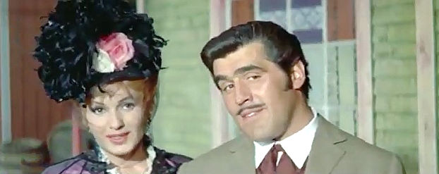 Mario Adorf as Matt Ellis and saloon singer Ilona (Fulvia Franco) arrive in Marble City in Massacre at Marble City (1964)