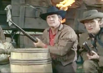 Olga Schoverova as Mary Brendel, Brad Harris as Phil Stone and Horst Frank as Dan McCormick with the wagon train under attack in Massacre at Marble City (1964)