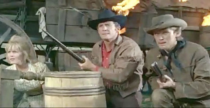 Olga Schoverova as Mary Brendel, Brad Harris as Phil Stone and Horst Frank as Dan McCormick with the wagon train under attack in Massacre at Marble City (1964)
