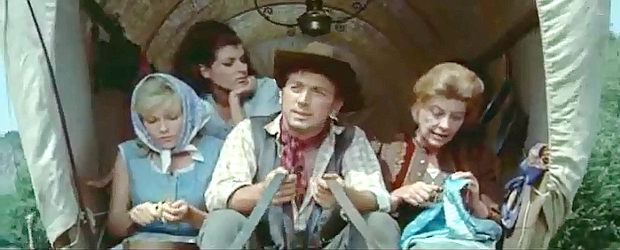 The Brendel family (from left), Mary (Olga Schoverova), Jane (Dorothree Parker), Erik (Thomas Alder) and Mrs. Brendel (Marianna Hoppe) head west in Massacre at Marble City (1964)