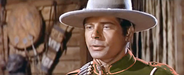Alan Scott as Cpl. Paul White, introducing himself as a new arrival in Cavalry Charge (1964)