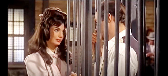 Barbara Nell (Barbara Nelly) as Margaret, visiting her brother after he's been jailed by her sheriff boyfriend in Four Bullets for Joe (1964)